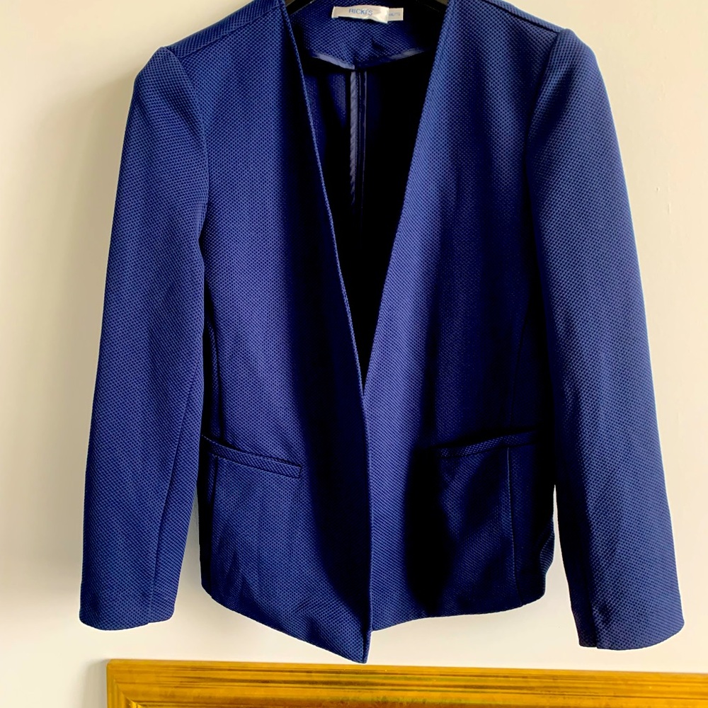 Navy blazer with waffle weave texture.
